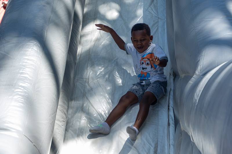 Ryker slides down slide at the Touch a Truck event on Saturday, June 28, 2025 at Centennial Park in Peru.