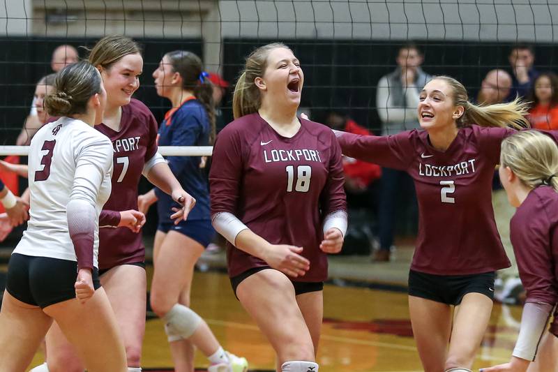 Lockport's Jenna Kolosta (18) celebrates a point with teammates during Class 4A Bolingbrook Sectional final match between Lockport at Oswego.  Nov 7, 2024  in Bolingbrook.
