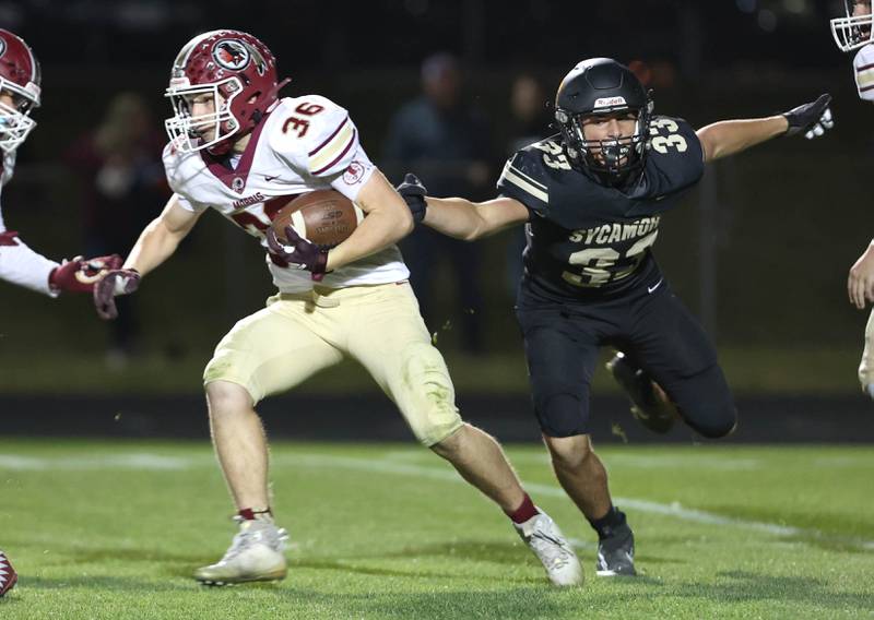 Morris' Jacob Swartz gets by Sycamore's Joseph Culotta during their game Friday, Oct. 21, 2022, at Sycamore High School.