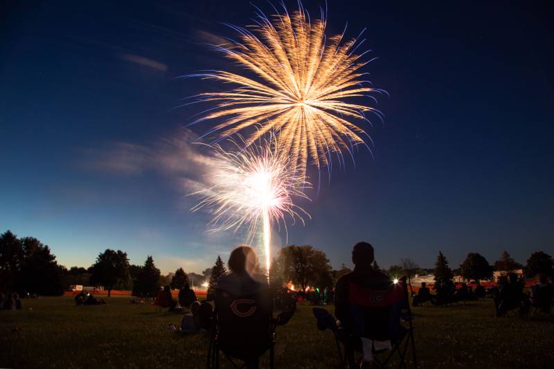 Patrons watch the fireworks during the Elburn Lions Club fireworks show at Lions Club Park on Saturday, July 9, 2022.