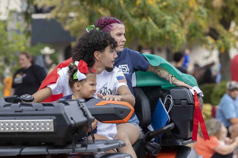 Celebrating Hispanic Heritage Month, a trio rides on a UTV through Sterling Saturday, Sept. 20, 2025, during the Fiesta Parade.