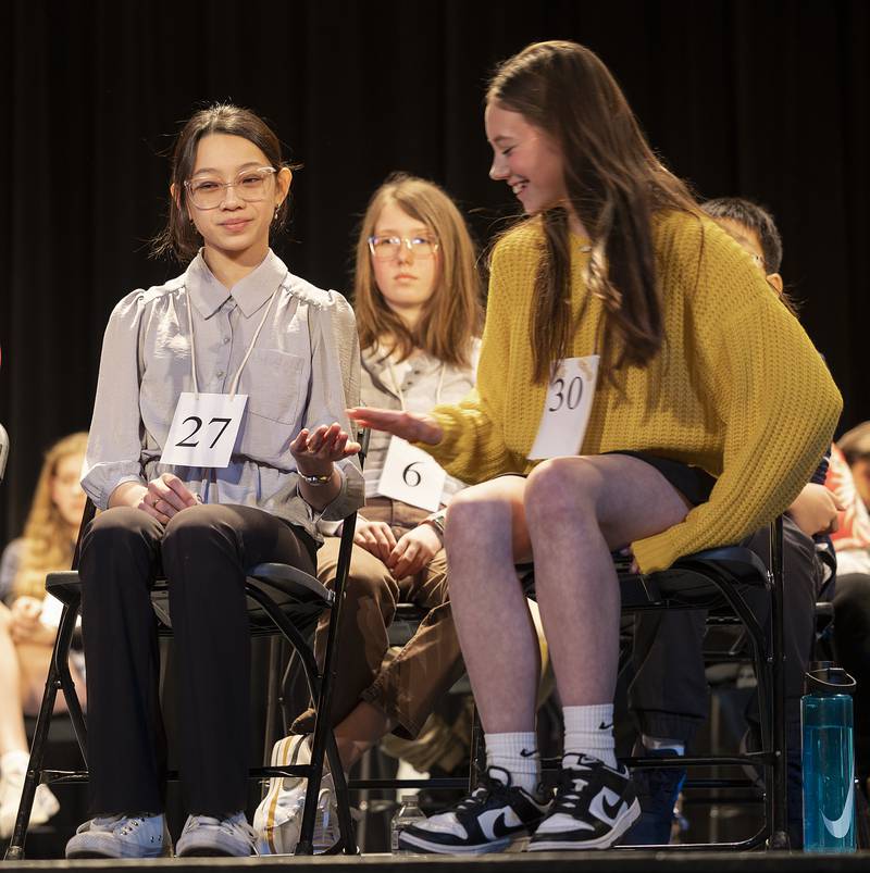 Lia Tran (left) of Oregon Jr. High and Cora Schmidt of Forreston Jr. High celebrate as they both made the top five Thursday, Feb. 20, 2025, at the Lee,Ogle, Whiteside County Spelling Bee.