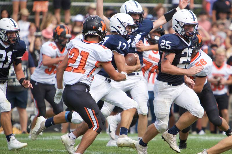 Cary-Grove's Gavin Henriques runs for a gain against McHenry on Saturday, Sept. 17,2022 in Cary.
