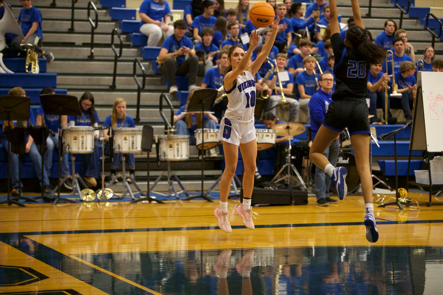 Geneva's Peri Sweeney shoots a three pointer over St. Charles North's Sydney Johnson on Friday, Jan. 17,2025 in Geneva.