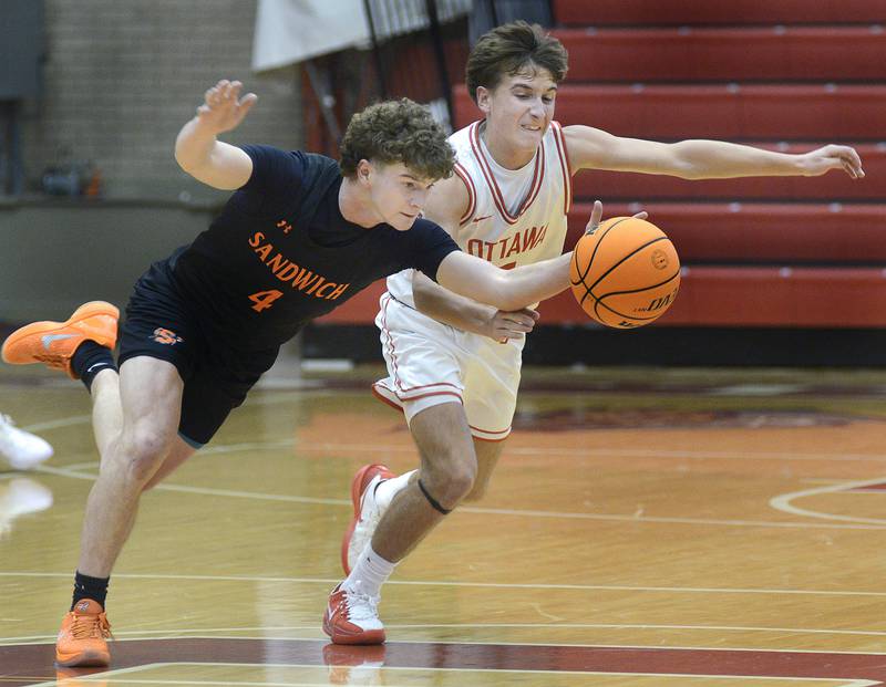 Sandwich’s Griffin Somolock steals the ball away from Ottawa’s Rory Moore in the 2nd period Tuesday at Ottawa.