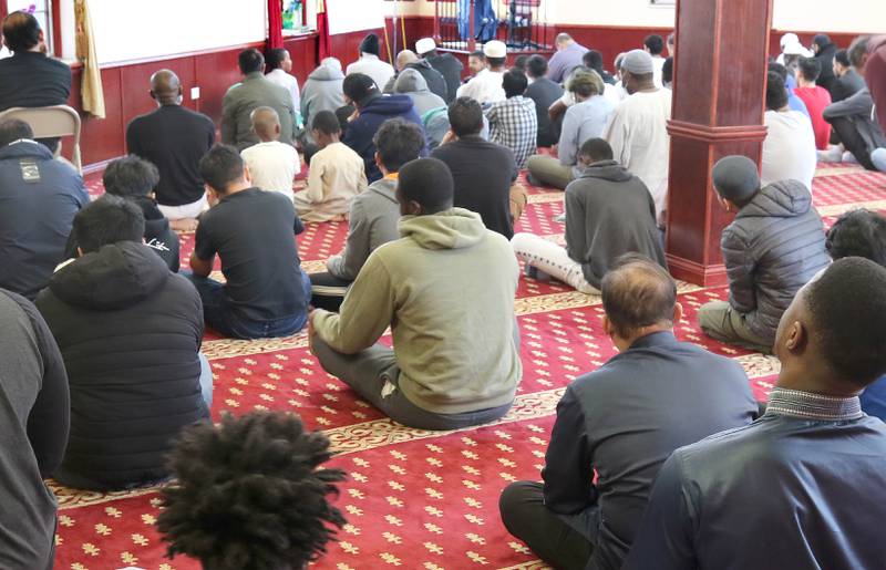Individuals assemble to pray Friday, April 7, 2023, in the prayer hall or musallā at the Islamic Center of DeKalb. Muslims are currently observing the holy month of Ramadan.