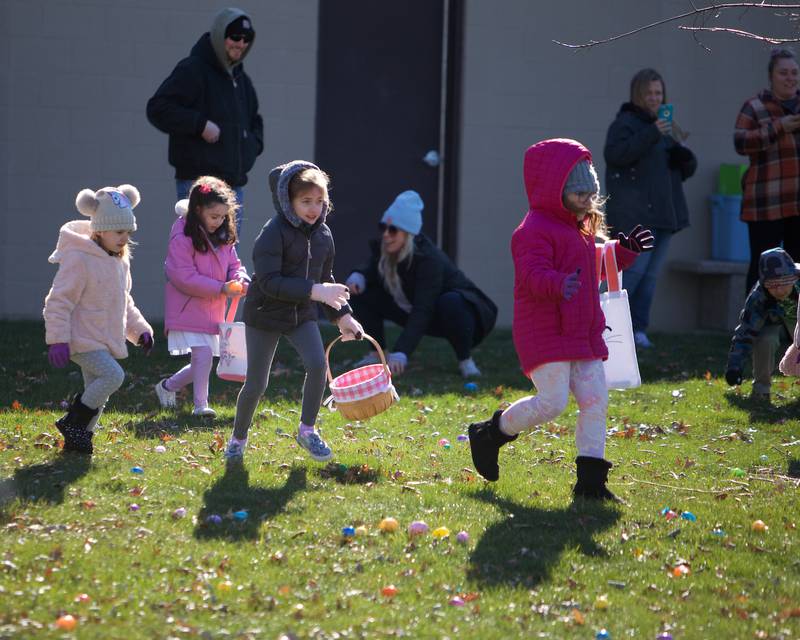 Kids enjoy the Easter Egg Hunt on Saturday, March 23,2024 at Lions Park in Elburn.
