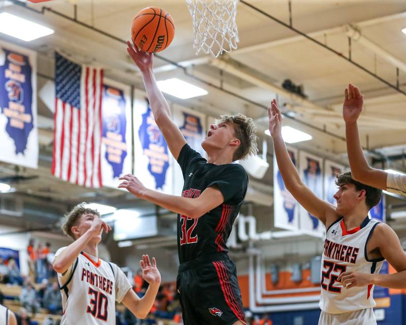 Yorkville's Joey Jakstys (32) puts in a layup during their basketball game between Yorkville at Oswego, Tuesday Dec 10, 2024 in Oswego.