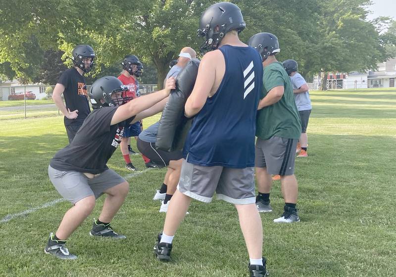 Flanagan-Cornell/Woodland lineman work on their burst during practice Monday, July 24, 2023, in Flanagan.