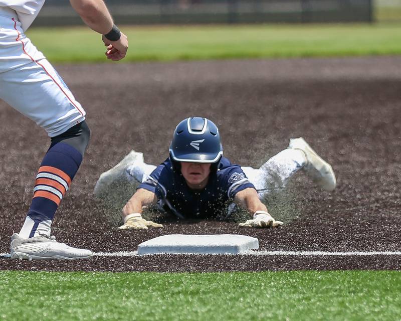 Oswego East's Dylan Kubek (11) slides into third during Class 4A Romeoville Sectional final game between Oswego East at Oswego.  June 3, 2023.
