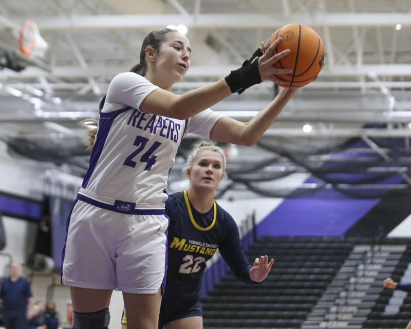 Plano's Chloe Rowe (24) grabs a rebound during their basketball game between Yorkville Christian at Plano Wednesday, Jan 07, 2026 in Plano.