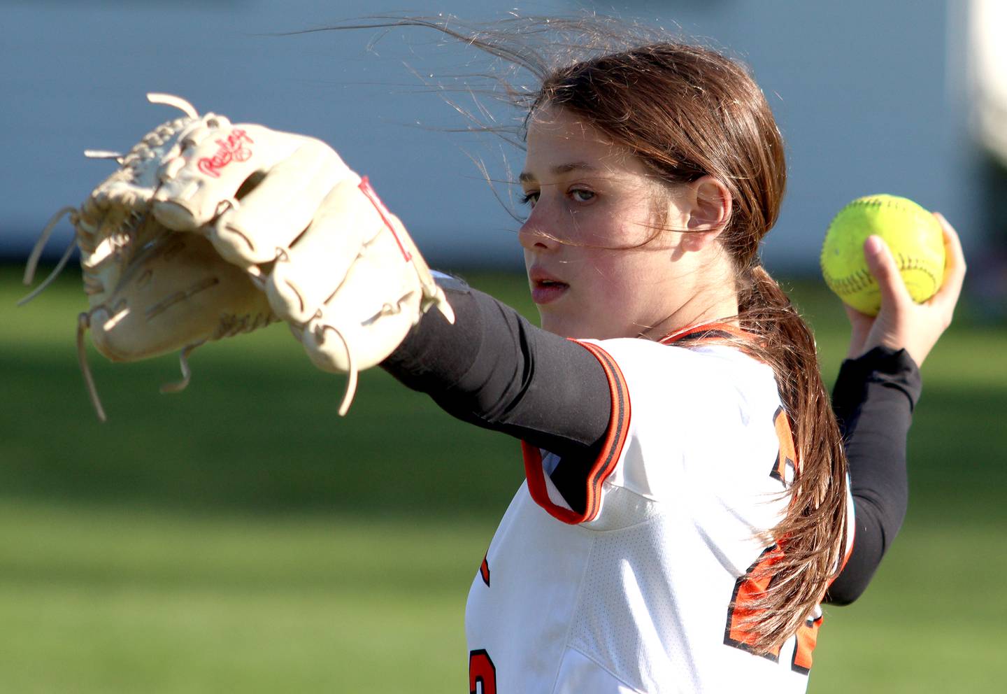 Crystal Lake Central’s Oli Victorine warms up during a game against Woodstock North in varsity softball at Crystal Lake Friday.