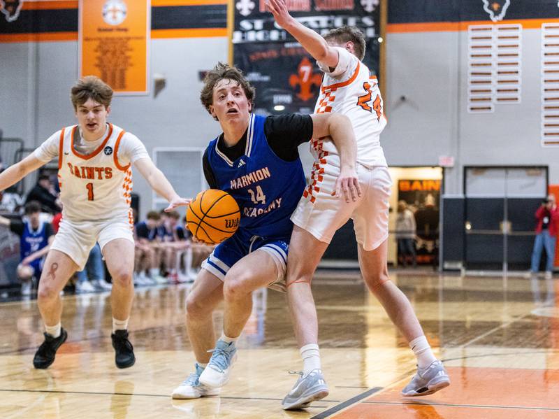 Marmion Academy guard Alex Eloe drives the lane during a game against St. Charles East High School on Saturday, Jan. 4, 2025.