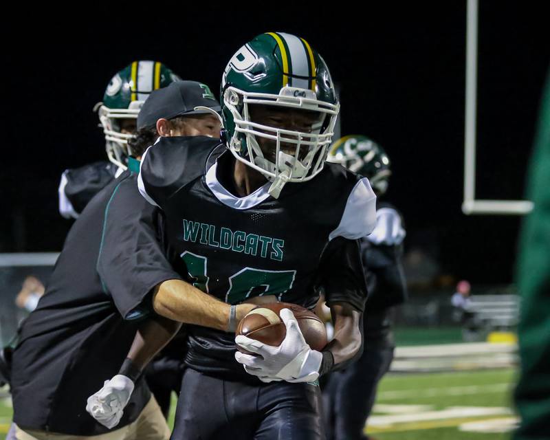 Plainfield Central's Stephon Griffin (10) celebrates an interception during football game between Joliet West at Plainfield Central.   Oct 20, 2023.