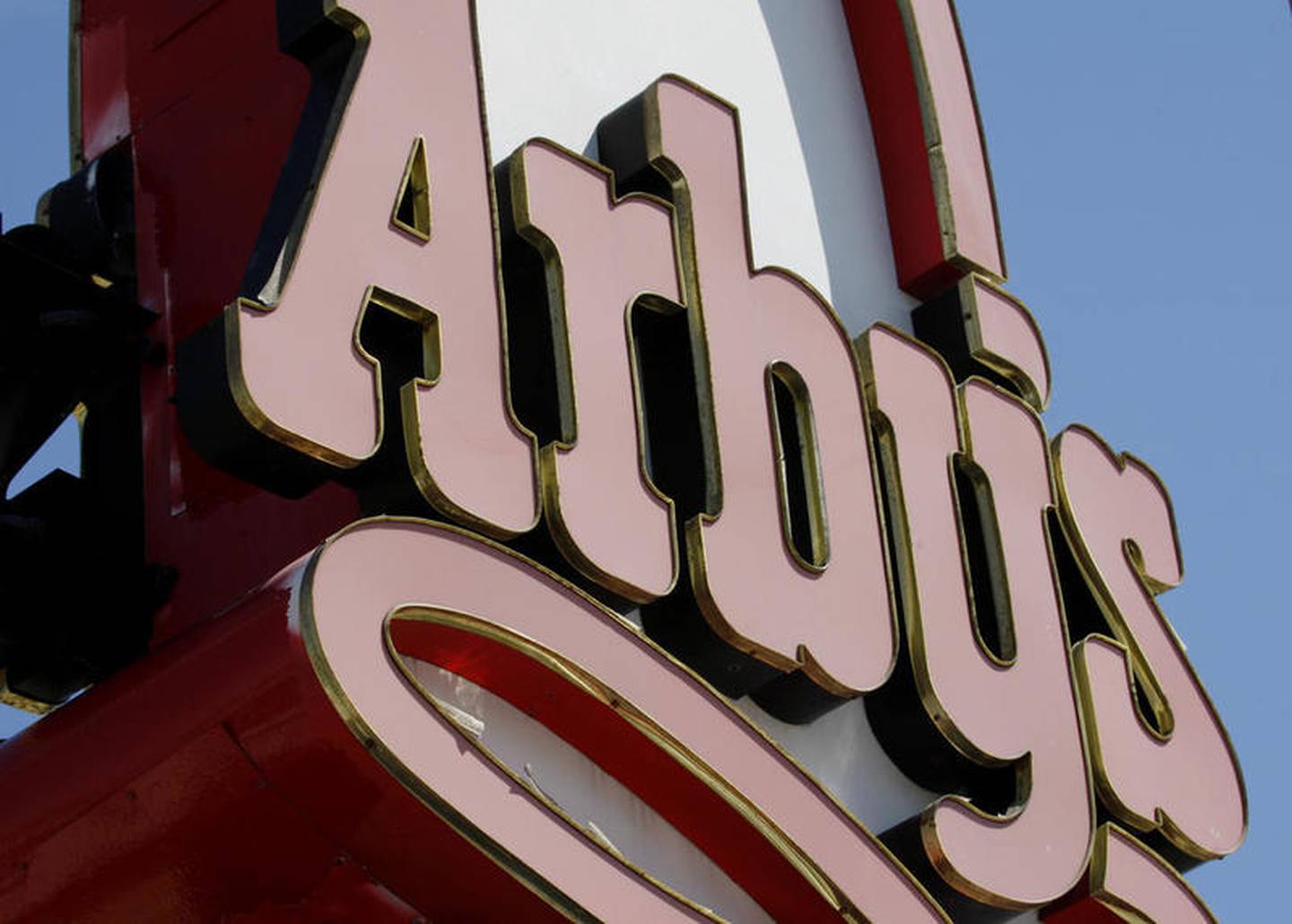 FILE - This March 1, 2010, file photo shows an Arby's restaurant sign in Cutler Bay, Fla. Arby's is buying casual dining chain Buffalo Wild Wings in a deal worth about $2.4 billion. Arby's Restaurant Group Inc. said Tuesday, Nov. 28, 2017, that it will pay $157 per share. (AP Photo/Wilfredo Lee, File)