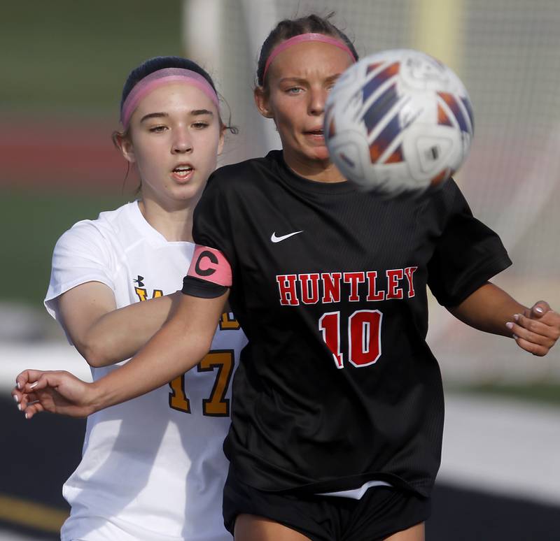 Huntley's Maddie Cummings tries to control the ball in front of Huntley's Itzel Martinez during the IHSA Class 3A Huntley Girls Soccer Regional championship match on Friday, May 23, 2025, at Huntley High School.