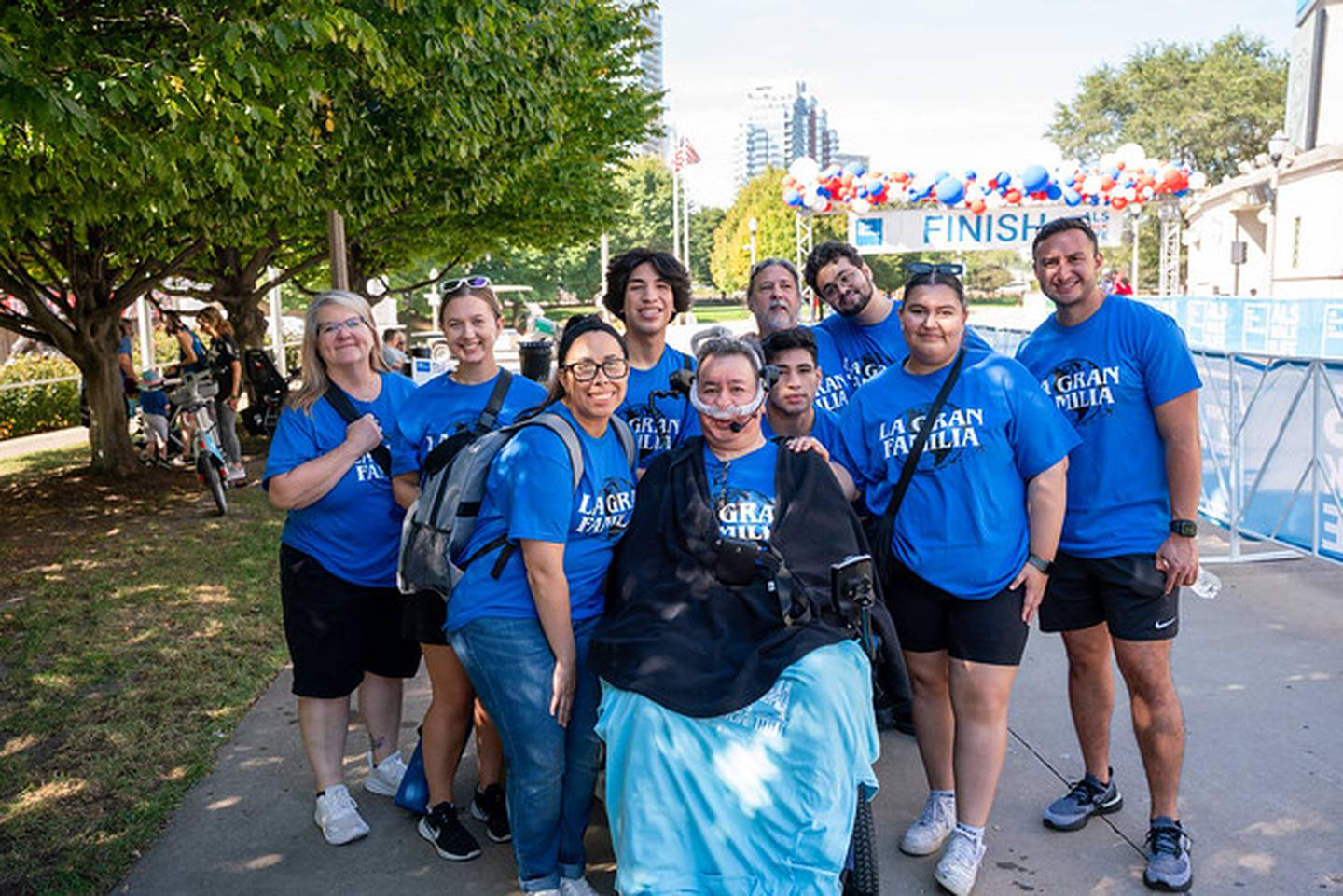 Hoffman Estates resident Mario Hernandez, 54, in his wheelchair surrounded by family and friends. Hernandez was diagnosed with ALS four years ago and is involved in the Les Turner ALS Foundation.