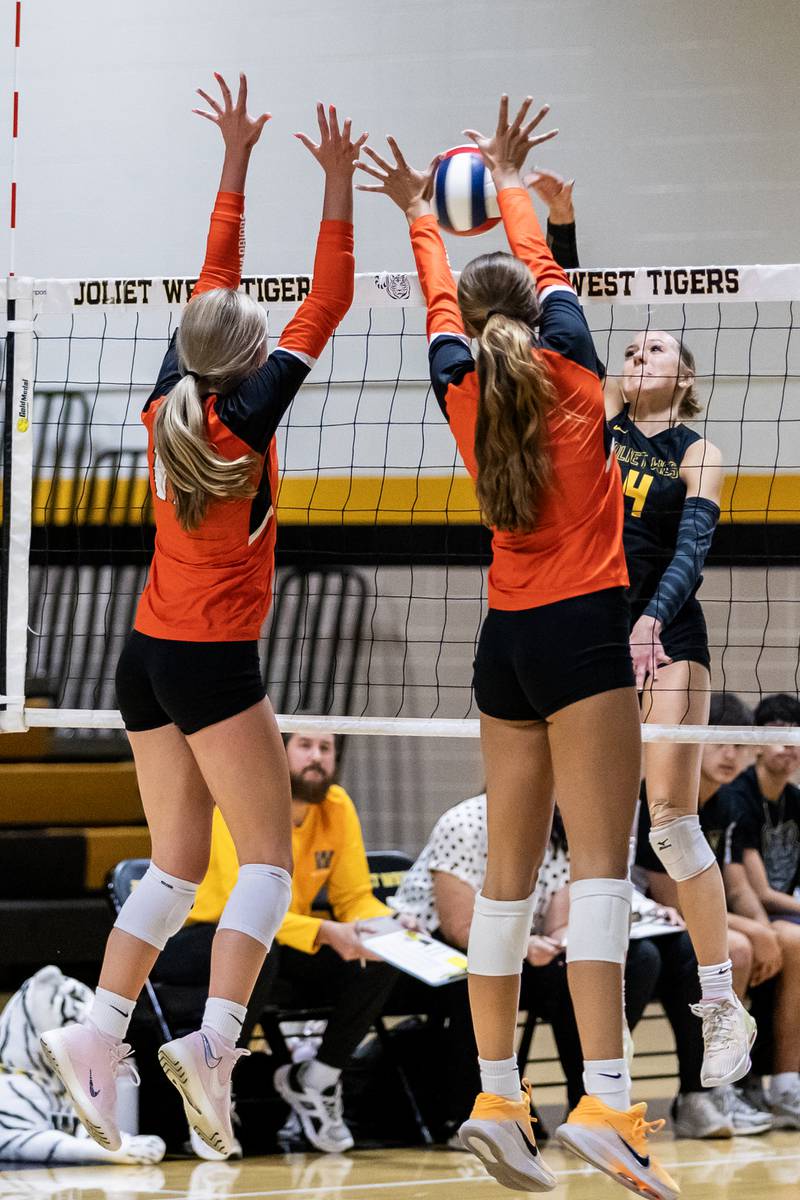 Joliet West's Lina Govoni spikes during a varsity volleyball home game against Lincoln-Way West on Sept. 15, 2025.
