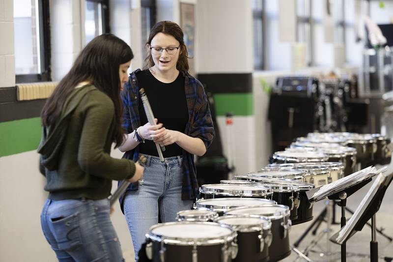 Rock Falls High School juniors Alma Cid (left) and Josie Adams talk about their rehearsals for their upcoming toms duet Sunday, Feb. 26, 2023 at the ninth annual Percussion Palooza.