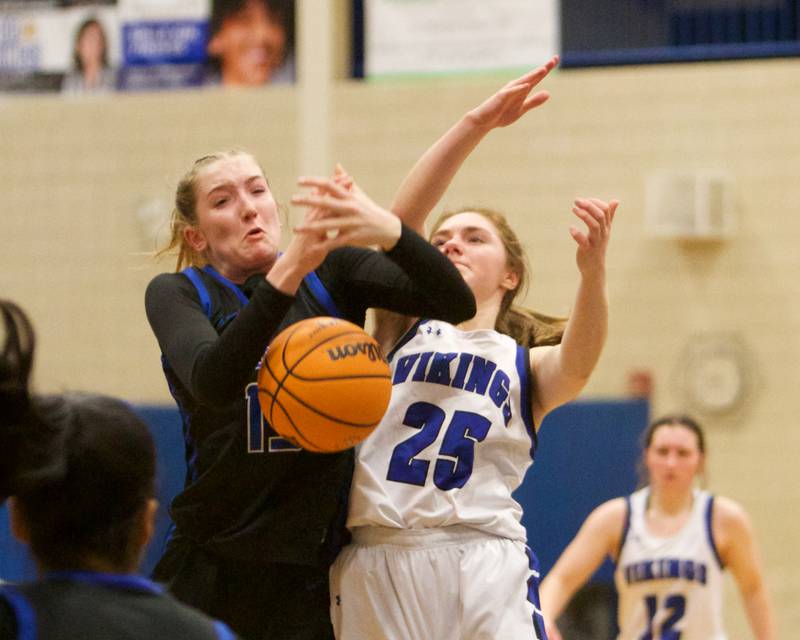 St. Charles North's Bronwyn How battles for the ball with Geneva's Bridget Hecker on Friday, Jan. 17,2025 in Geneva.