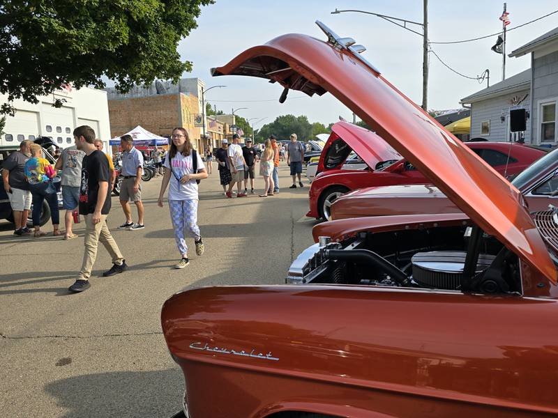 A crowd walks down La Salle Street on Saturday, Aug. 24, 2024, during the Tonica Fest car show.