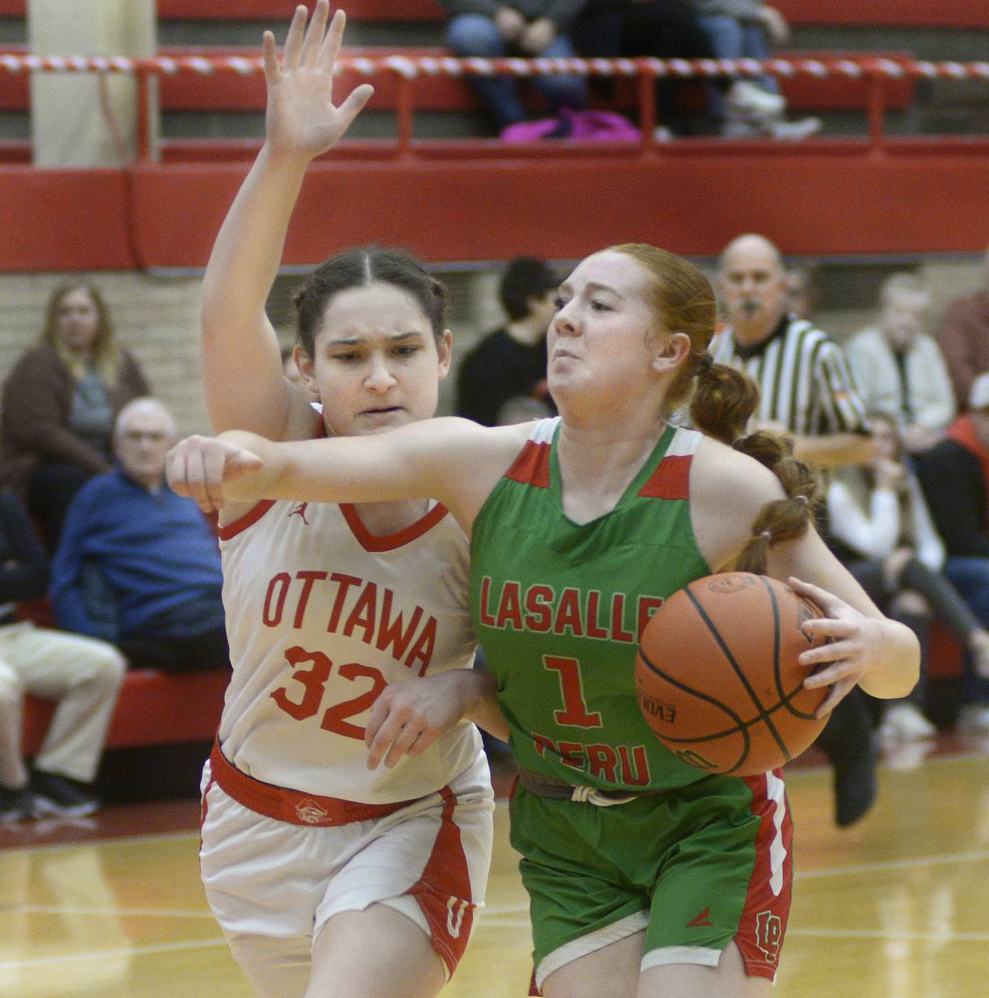 LaSalle Peru’s Addison Duttlinger drives past Ottawa’s Mary Stisser Thursday during the 2nd period at Ottawa.