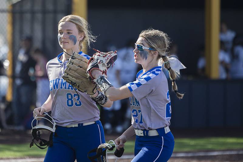 Newman’s Jess Johns (left) comes in after snagging a line drive and turning it into a double play against Sterling Thursday, April 27, 2023.