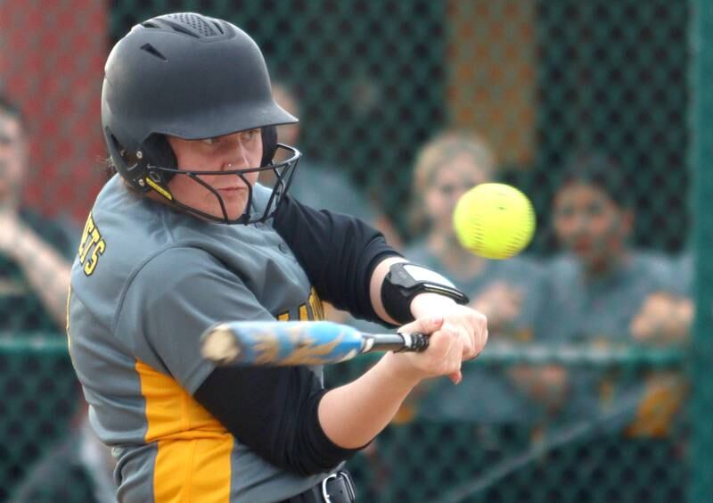 Harvard’s Ava Borchardt makes contact in varsity softball at Marengo Thursday.
