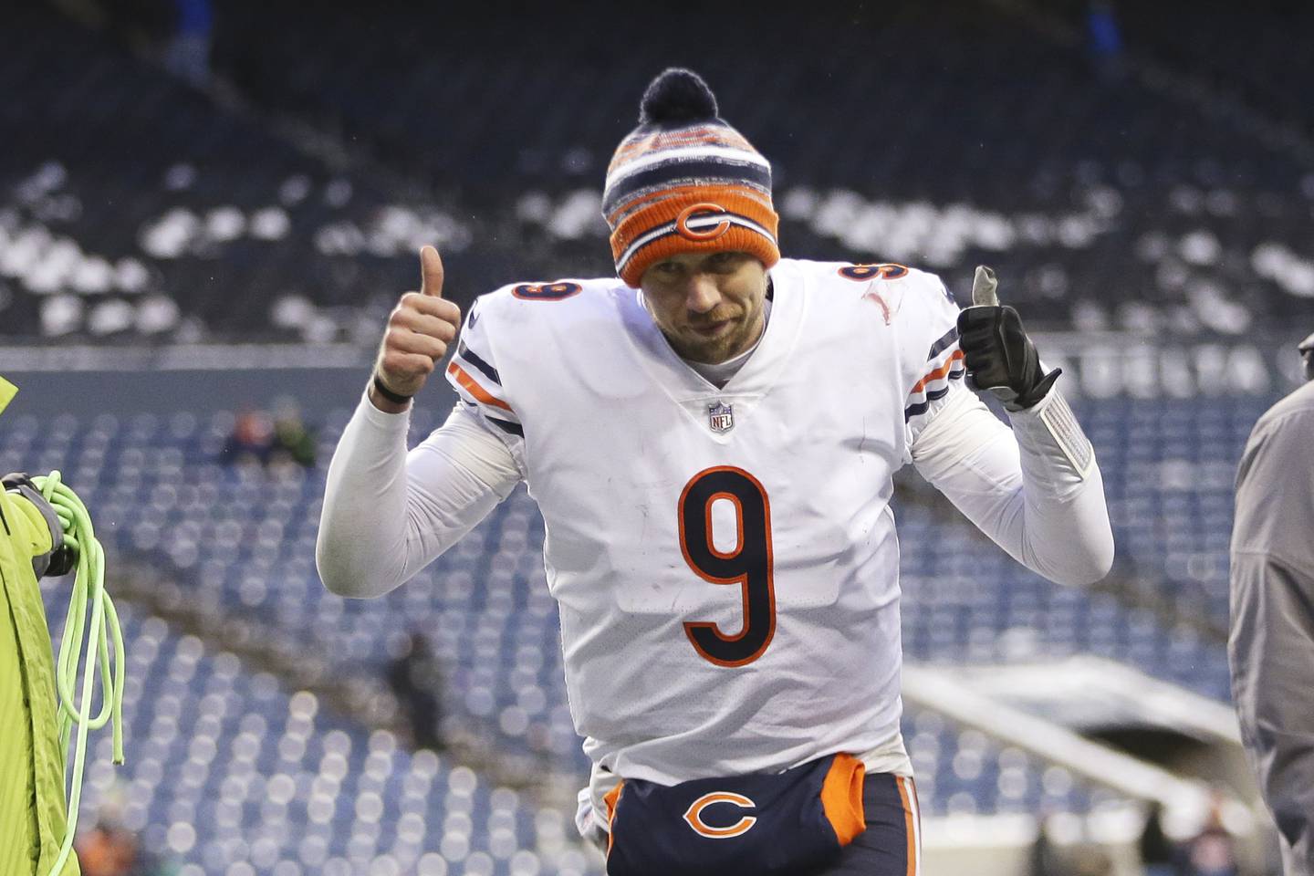 Chicago Bears quarterback Nick Foles gives a thumbs-up as he heads off the field after the team beat the Seattle Seahawks on Sunday, Dec. 26, 2021, in Seattle.