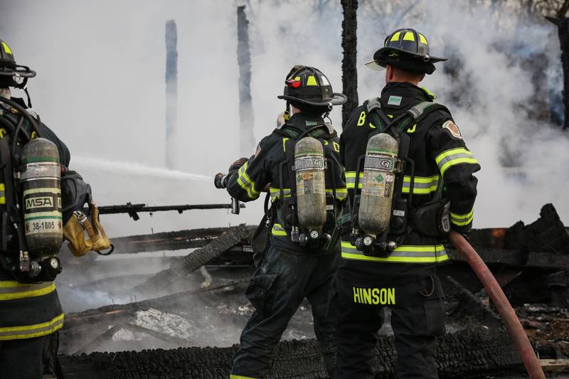 FIrefighters with the Barrington Countryside Fire Protection District work to put out a barn fire in Barrington Hills on Saturday afternoon, Dec. 31, 2022.