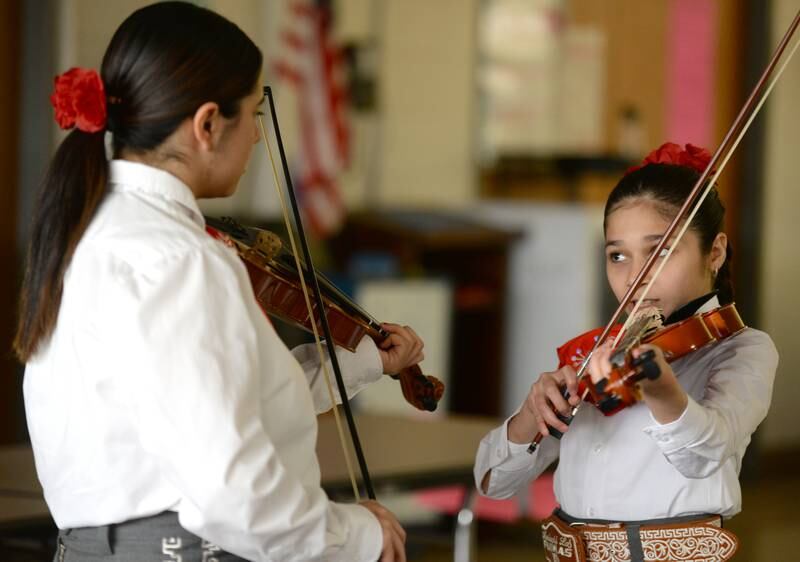LaGrange school district 102 7th grader (left) Valeria Contrerais and 6th grader Mariela Garcia practice prior to performing in  the cultural celebration, Expo De Bellas Artes held at Park Junior High Friday April 21, 2023.