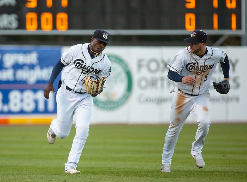 Left fielder Cornelius Randolph and third baseman Alexis Pantoja run to the dug out after the end of the inning during a game against the Milwaukee Milkmen at Northwestern Medicine Field on Friday, July 29, 2022.