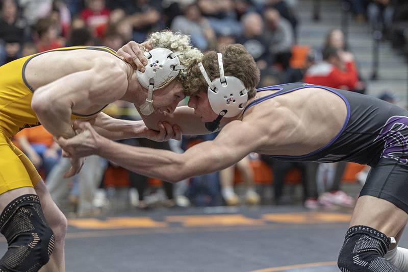 Arrison Bauer (left) and Dixon’s Charlie Connors go head to head in the 144 pound first place match Saturday, Feb. 14, 2026, during the Class 1A wrestling sectionals in Byron.
