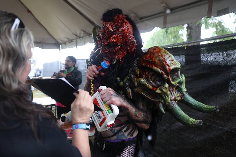 A member of GWAR does a interview on a toy recorder in the press area at Riot Fest on Sunday, Sept. 22, 2024 in Chicago.