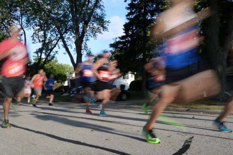 Runners and walkers participate in the Downers Grove BBQ Bolt 5K Aug. 29.