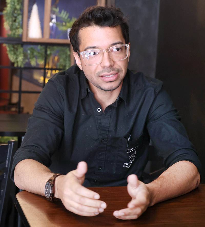Emmanuel González, owner of Provecho Home Made Food talks Friday, May 22, 2026, at restaurant, about some of the offerings available at the eatery. Provecho is a new Venezuelan homemade food restaurant that has recently opened at 131 East Lincoln Highway, in DeKalb.