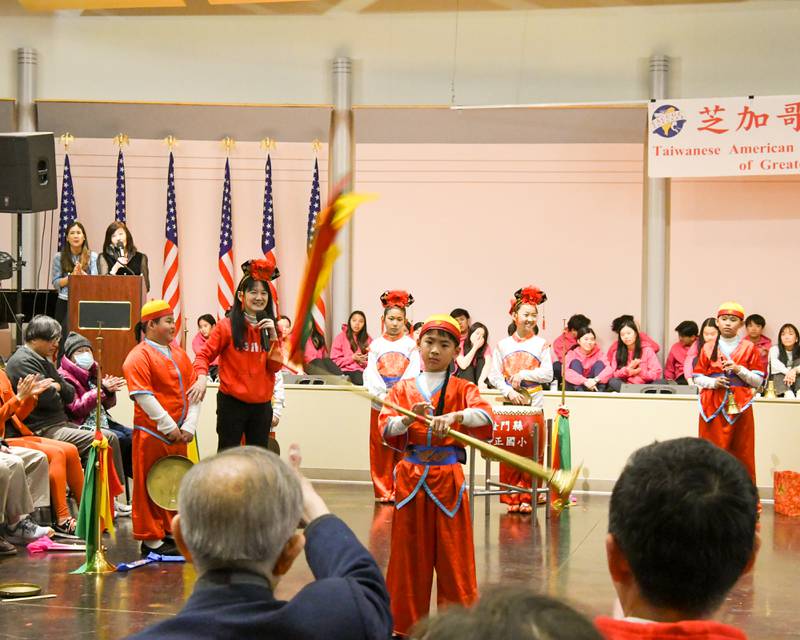 A student from the Jhong Jheng Elementary School Suona and Drum Ensemble from Kinmen, Taiwan, demonstrates his twirling technique used during the performance on Saturday April 19, 2025, held at the Taiwanese American Chamber of Commerce building in Westmont.