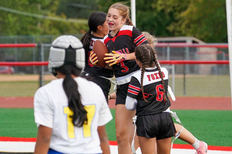 Yorkville's Annabel West (3) celebrates with her team after scoring a touchdown against Joliet Central during a flag football game at Yorkville High School on Monday, Sep 23, 2024.