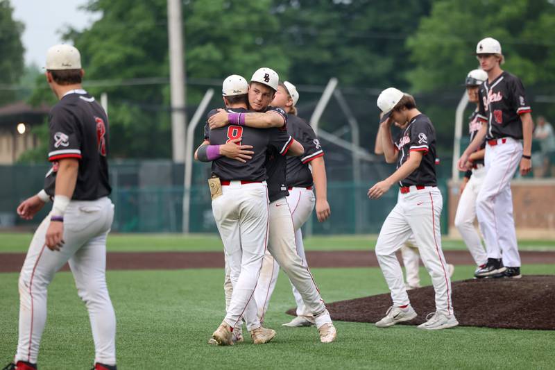 Bradley-Bourbonnais senior Cody Freitas receives a hug from teammate Cooper Daugherty as the Boilermakers lost 2-0 to Normal Community in the IHSA Class 4A Illinois Wesleyan University Sectional semifinal on Thursday, June 5, 2025.
