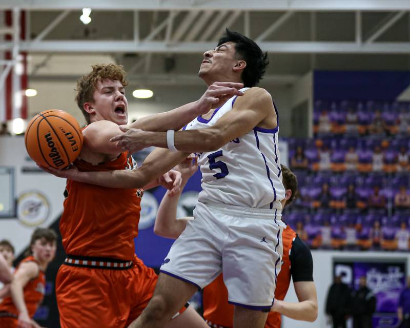Plano's Alan Contreras (5) is fouled on a shot attempt during their basketball game between Sandwich at Plano. Jan 27, 2025 in Plano.