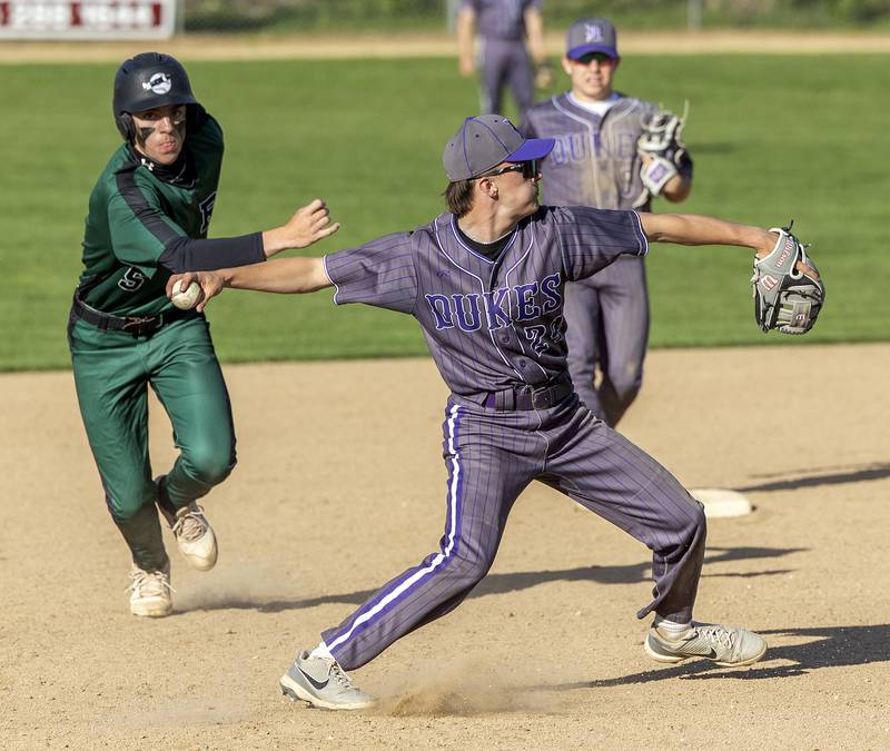 Dixon’s Brady Feit fires to first for an out against Rock Falls Tuesday, April 29, 2025.