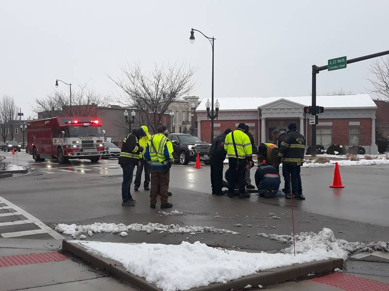 Crews work inside a manhole Wednesday, Jan. 25, 2023, at the corner of Jefferson and Columbus streets in Ottawa on what appeared to be a fuel spill through Ottawa's storm sewer system into the Fox River.