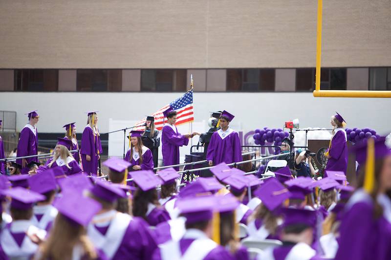 Downers Grove North graduates receive their diploma at the Commencement Ceremony on Sunday, May 18, 2025 in Downers Grove.
