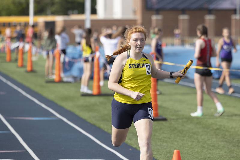 Sterling’s Kylie Nicklaus finishes the race in the 4x800 Thursday, May 11, 2023 at the class 2A Sterling girls track sectionals.