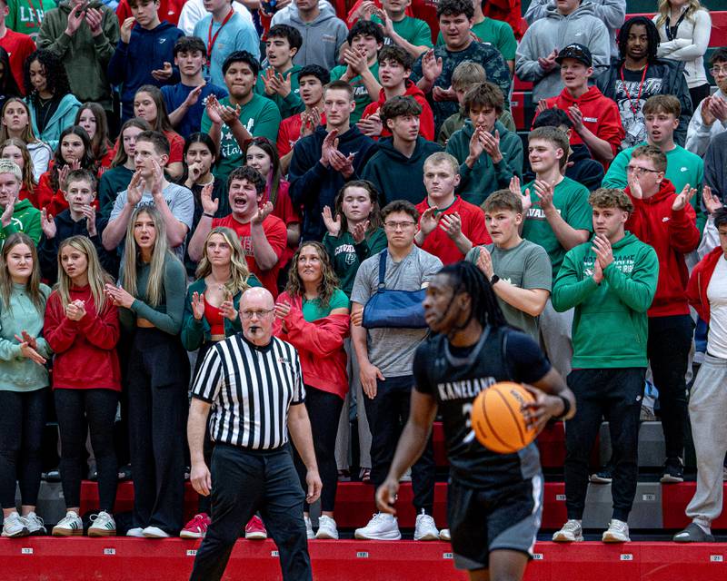 LaSalle-Peru's student section chants as Kaneland's Marshawn Cocroft dribbles ball down court on Friday, Feb. 20, 2026 in Sellett Gymnasium at L-P High School.