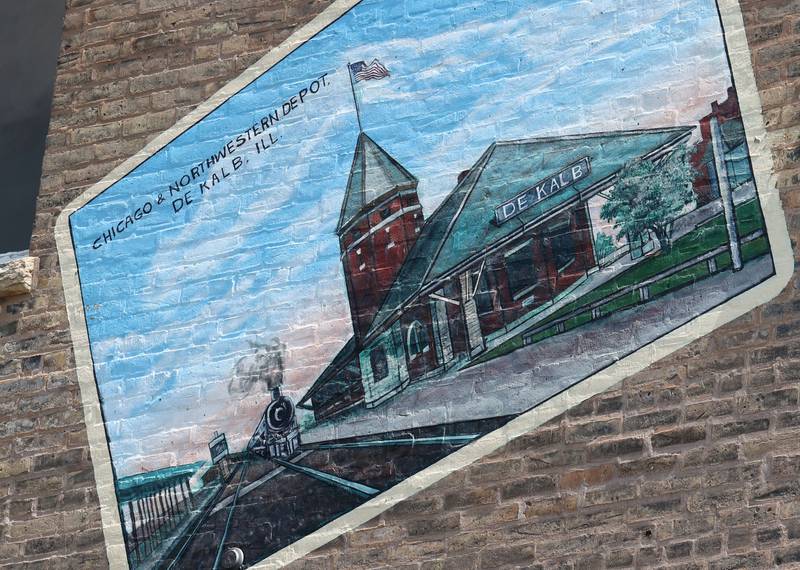 A detail of the mural titled “Its Merits Recommend It...” by artist Olivia Gude Tuesday, July 22, 2025. The artwork graces the side of the building at the corner of Lincoln Highway and First Street in DeKalb.