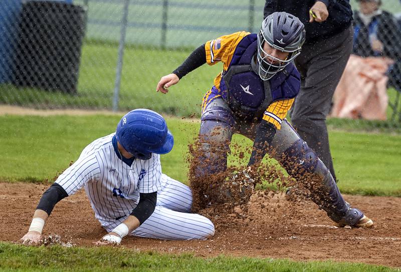Newman’s Drake Cole is tagged out at home on a force play against Mendota Thursday, April 30, 2026.