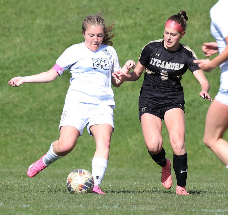 Kaneland's Lindsey Stoddard (left) and Sycamore's Marin Gautcher fight for possession during their game Monday, April 14, 2025, at Sycamore High School.