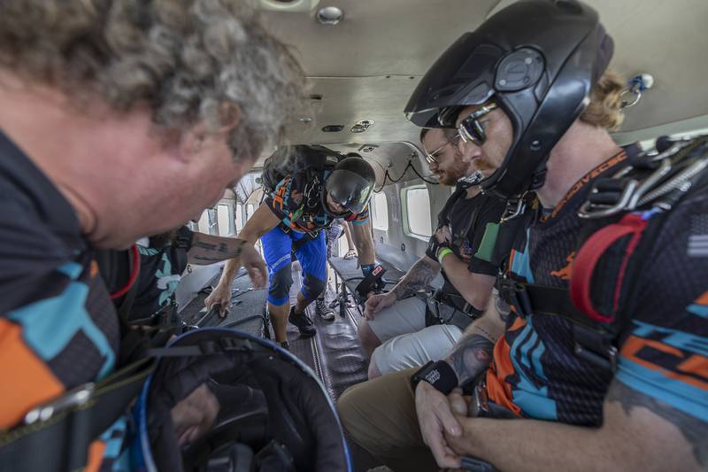 Skydivers file into the empty plane Friday, June 27, 2025. Members of the first group were joined by their tandom jumpers and several other solo skydivers.
