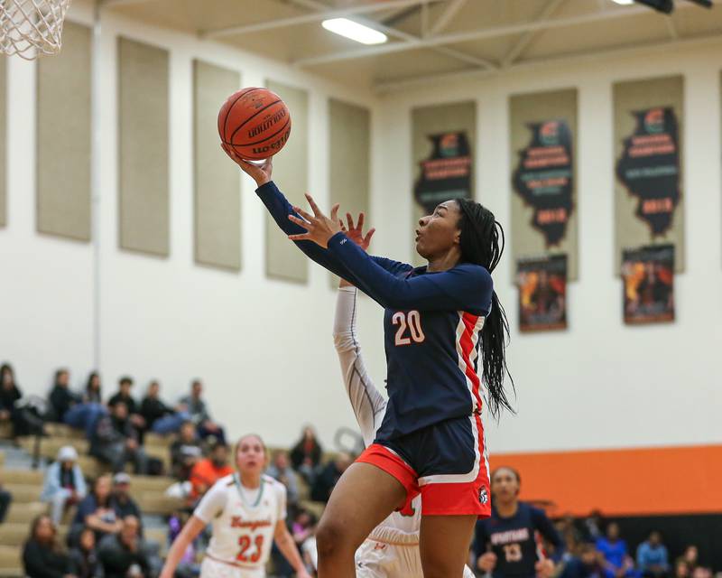 Romeoville's Laila Houseworth (20) goes in for a lay up during basketball game between Romeoville at Plainfield East. Feb 8, 2024.